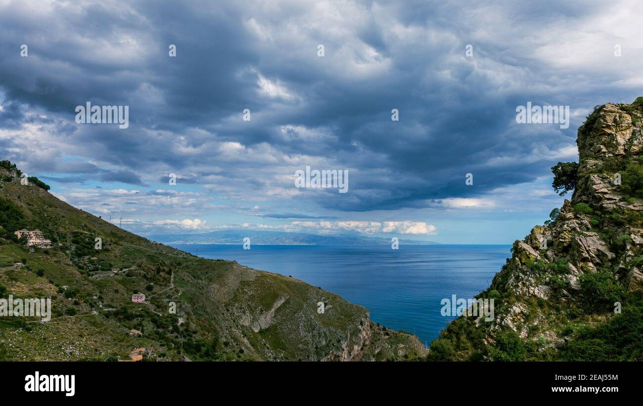 between sky and sea black clouds. Stock Photo
