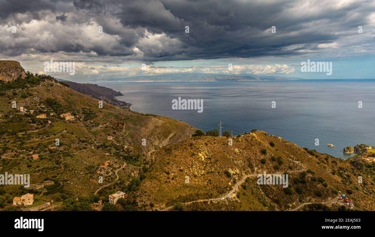 between sky and sea black clouds. Stock Photo