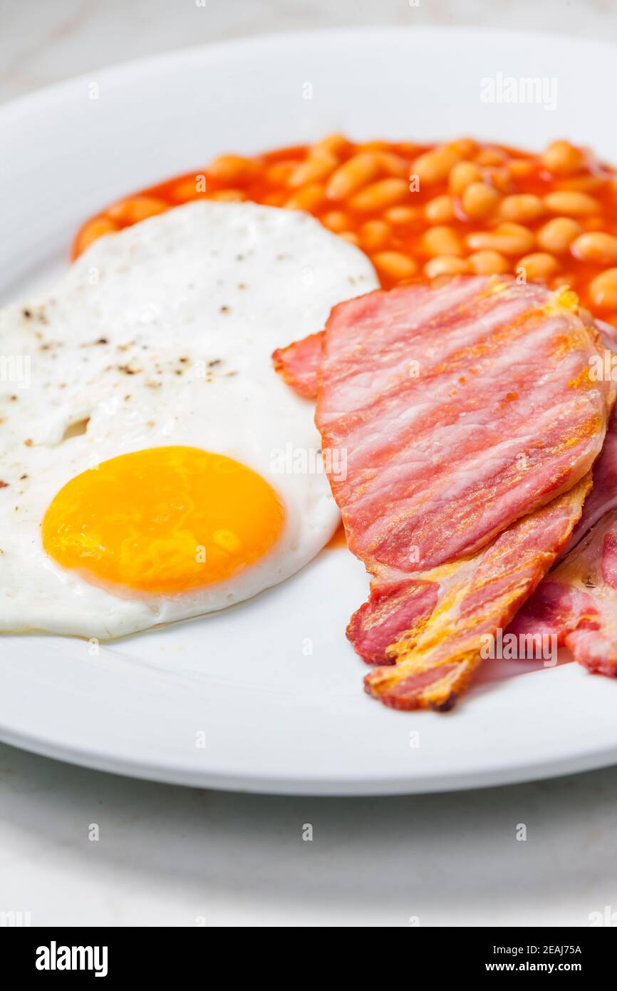 English breakfast with bacon beans and egg Stock Photo Alamy
