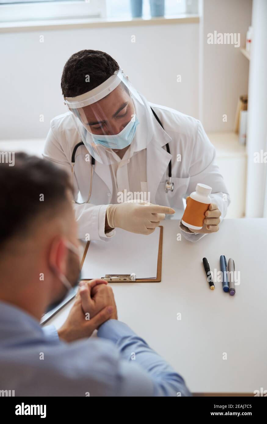 Doctor giving recommendation for good health in cabinet Stock Photo - Alamy