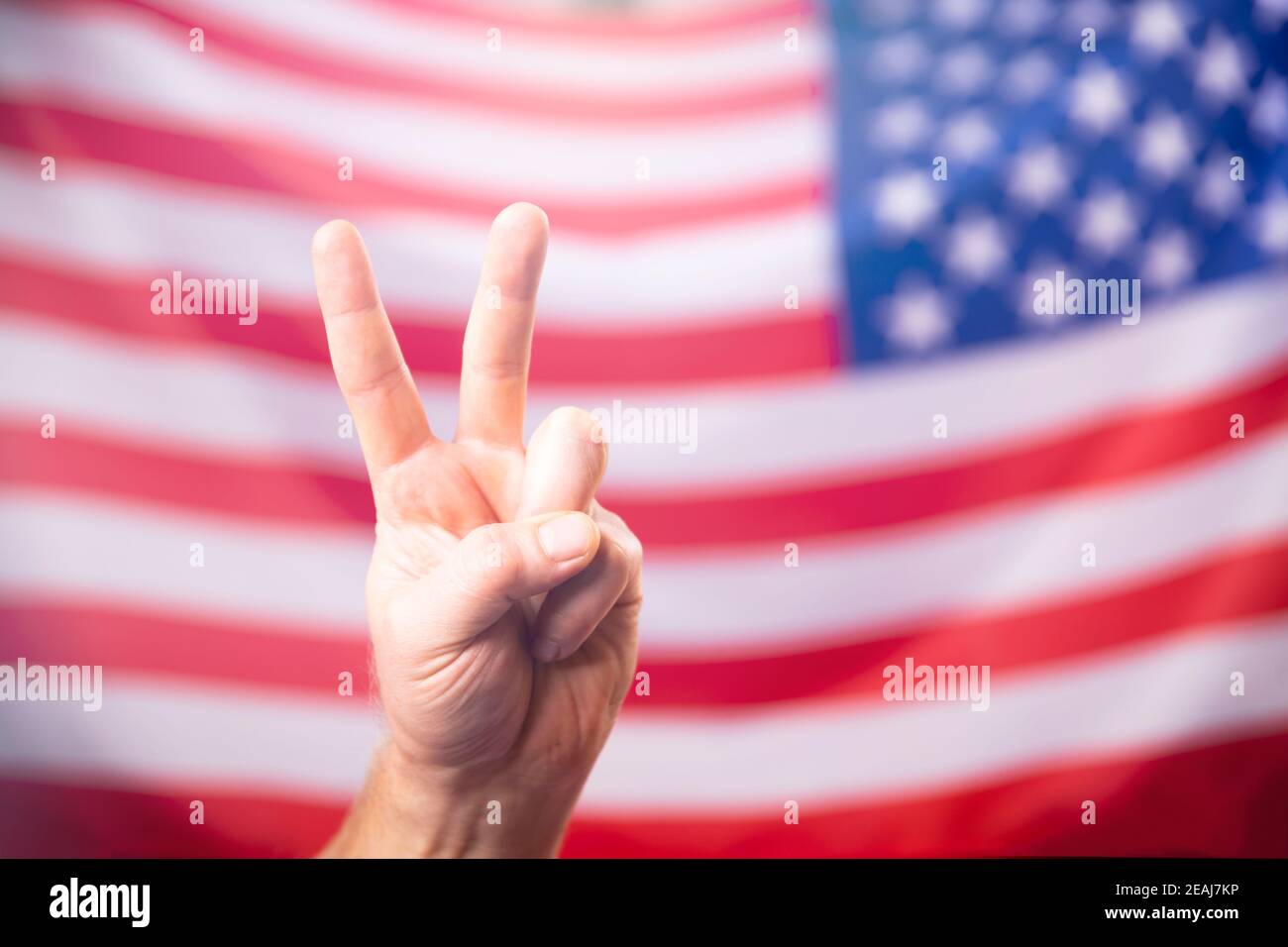 American flag with victory sign Stock Photo
