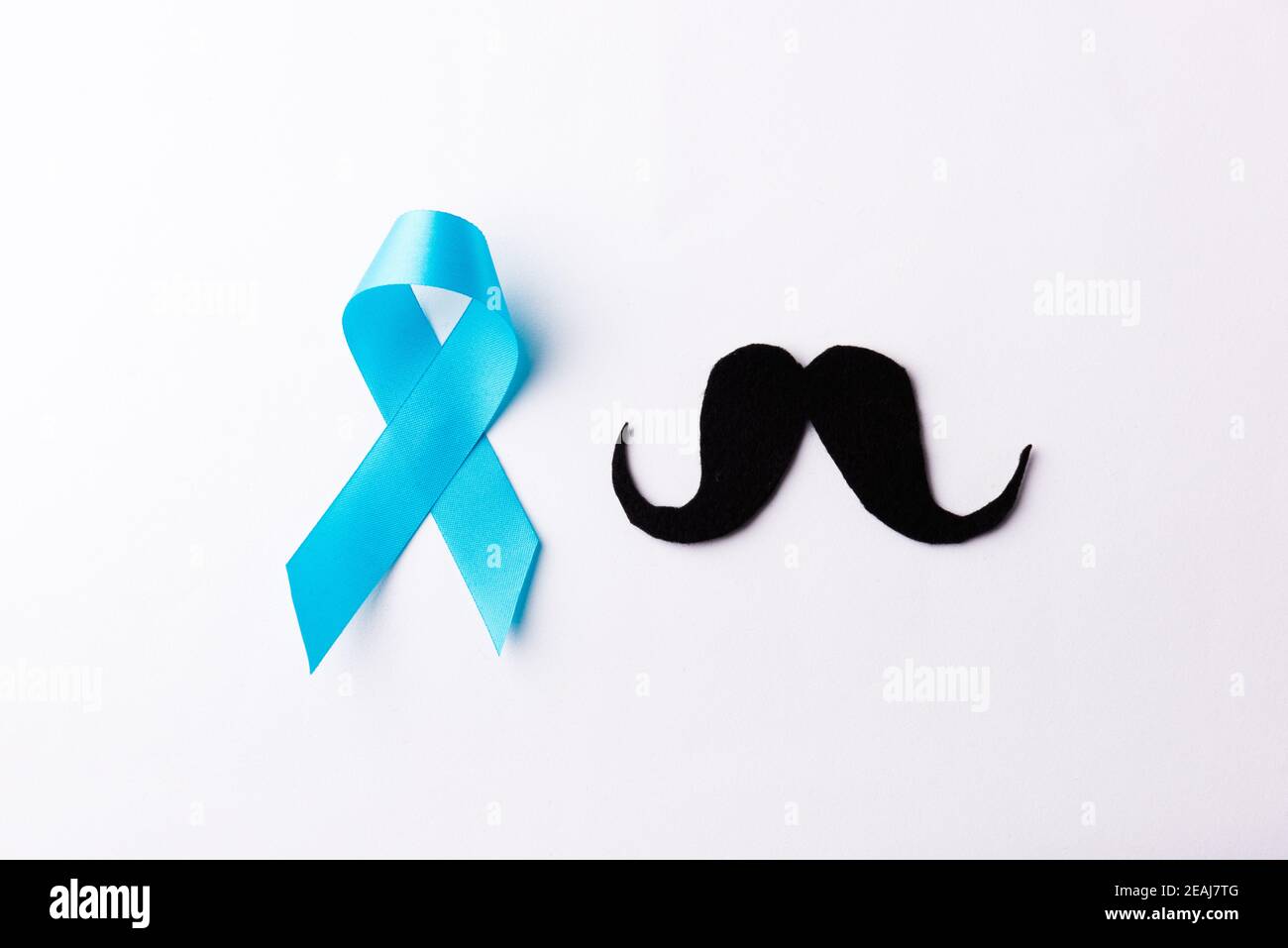 Black mustache paper and light blue ribbon Stock Photo
