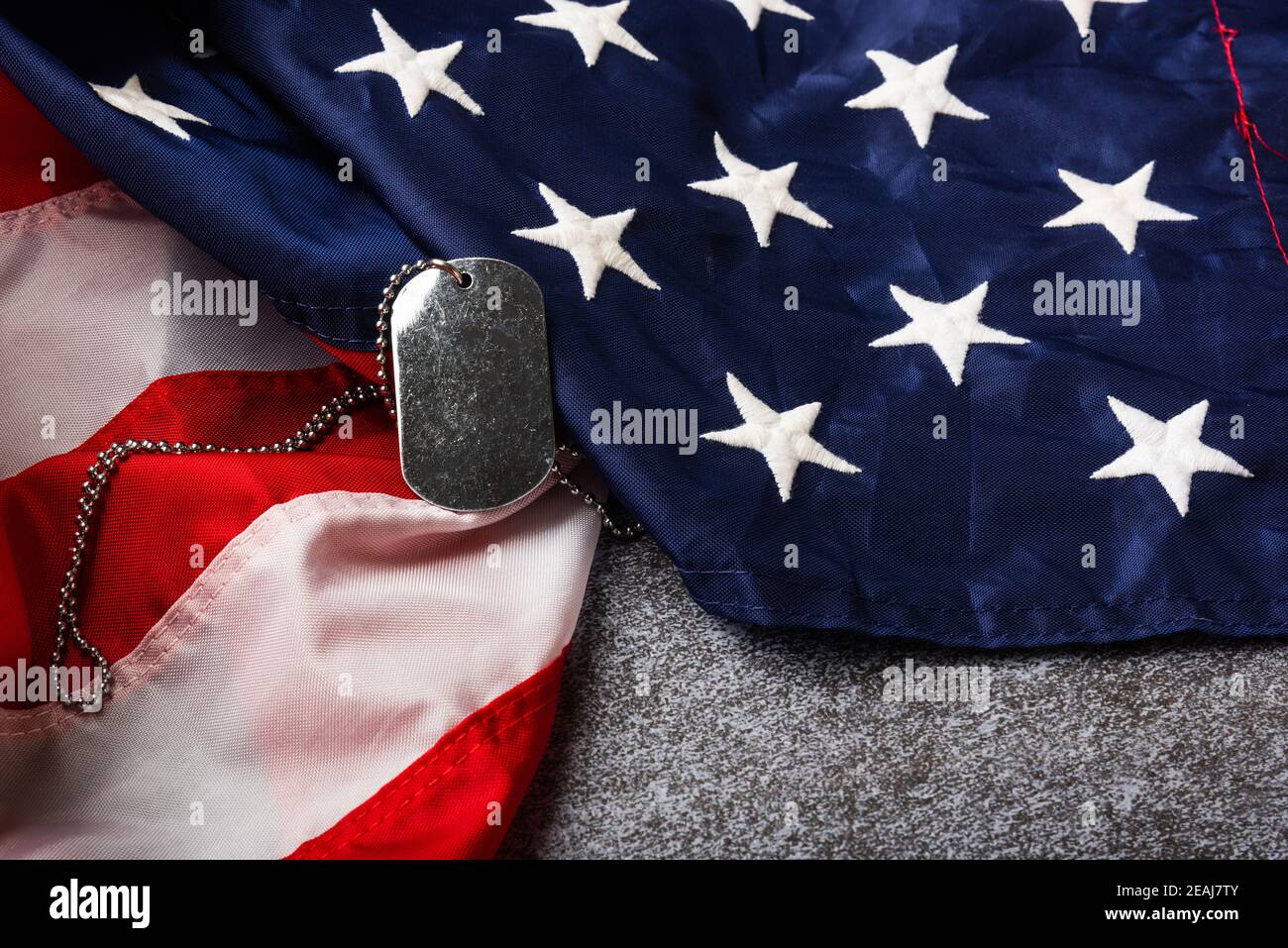 America United States flag and chain dog tags Stock Photo - Alamy