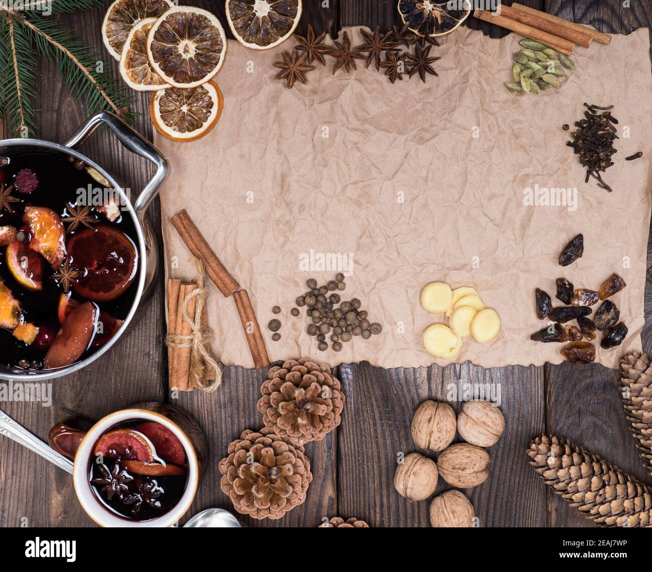 ingredients for making mulled wine on a wooden table and a piece of brown paper Stock Photo