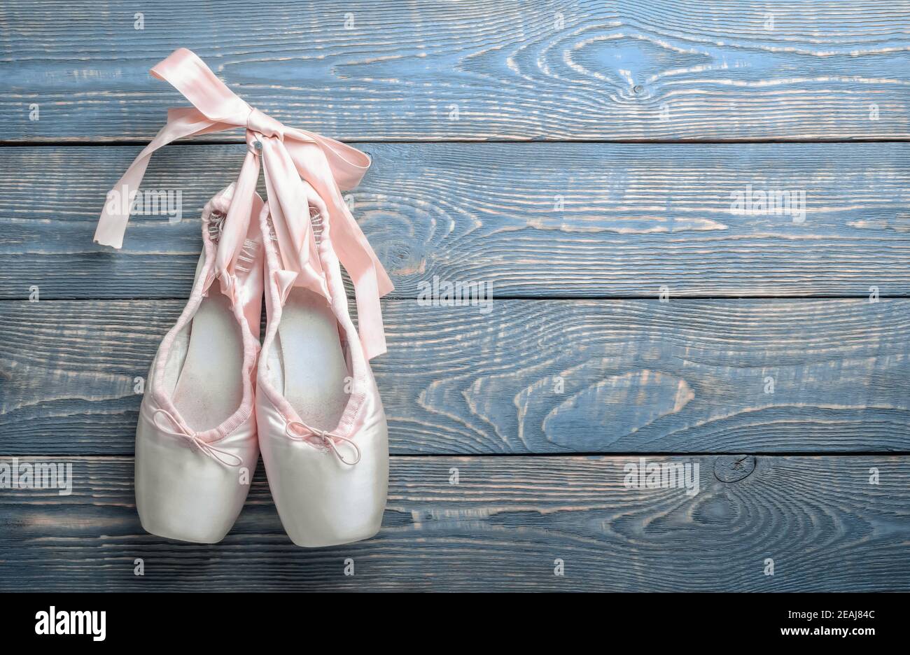 wallpapers Hanging Pointe Shoes Png https www alamy com pointe shoes ballet dance shoes with a bow of ribbons hang on a nail on a wooden background image402386556 html