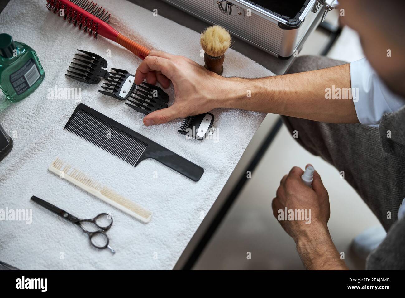 Work desk of hair dresser with special modern machine and brush in