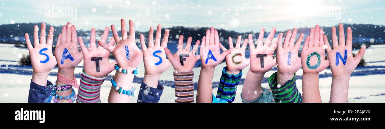 Children Hands Building Word Satisfaction, Snowy Winter Background Stock Photo