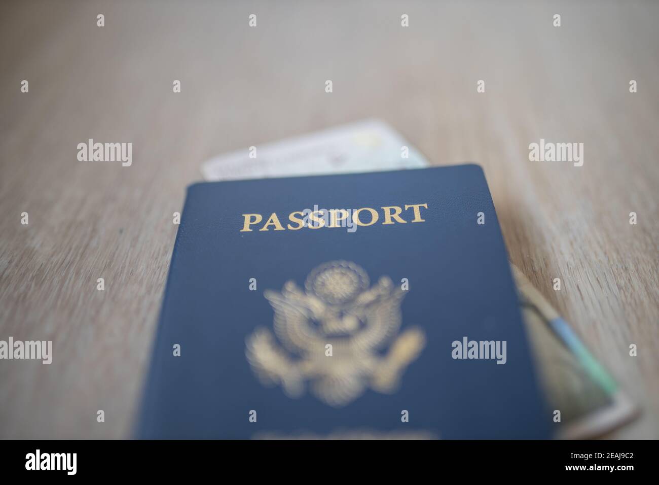 United States Of America Passport With A 2000 Colombian Pesos Bill united-states-of-america-passport-with-a-2000-colombian-pesos-bill