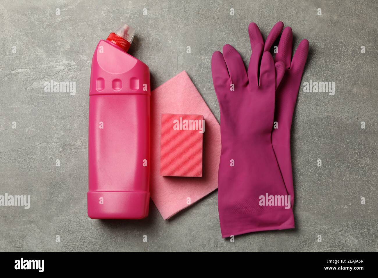 Cleaning tools on gray background, top view Stock Photo