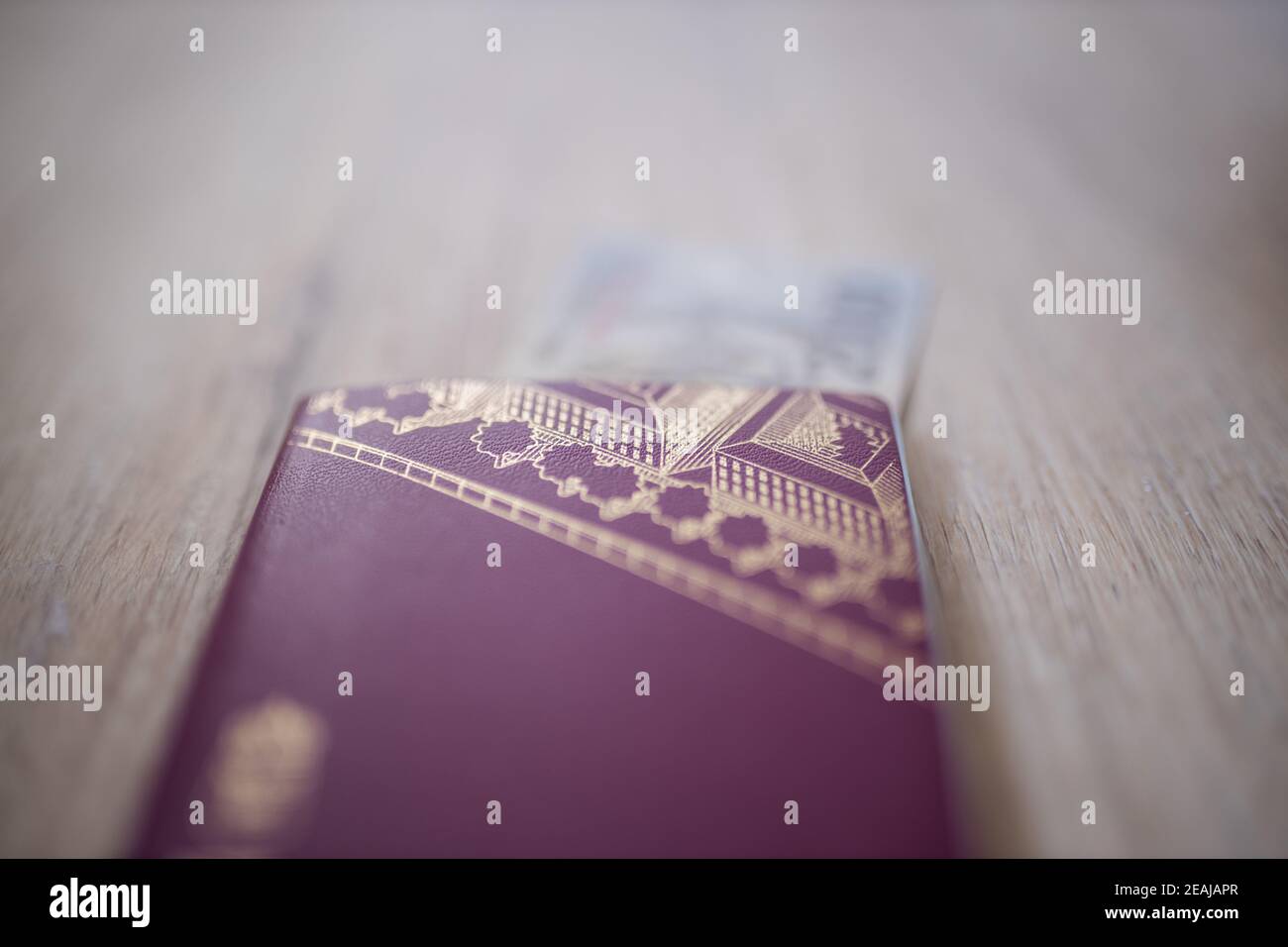 Sweden Passport with a Two Thousand Indonesian Rupees Bill Partially Inside Stock Photo