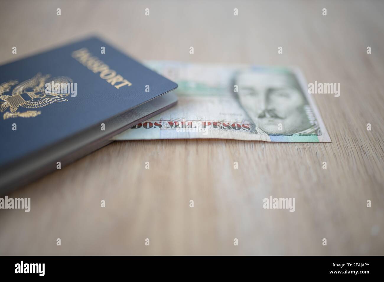 A 2000 Colombian Pesos Bill Inside A United States Of America Passport a-2000-colombian-pesos-bill-inside-a-united-states-of-america-passport