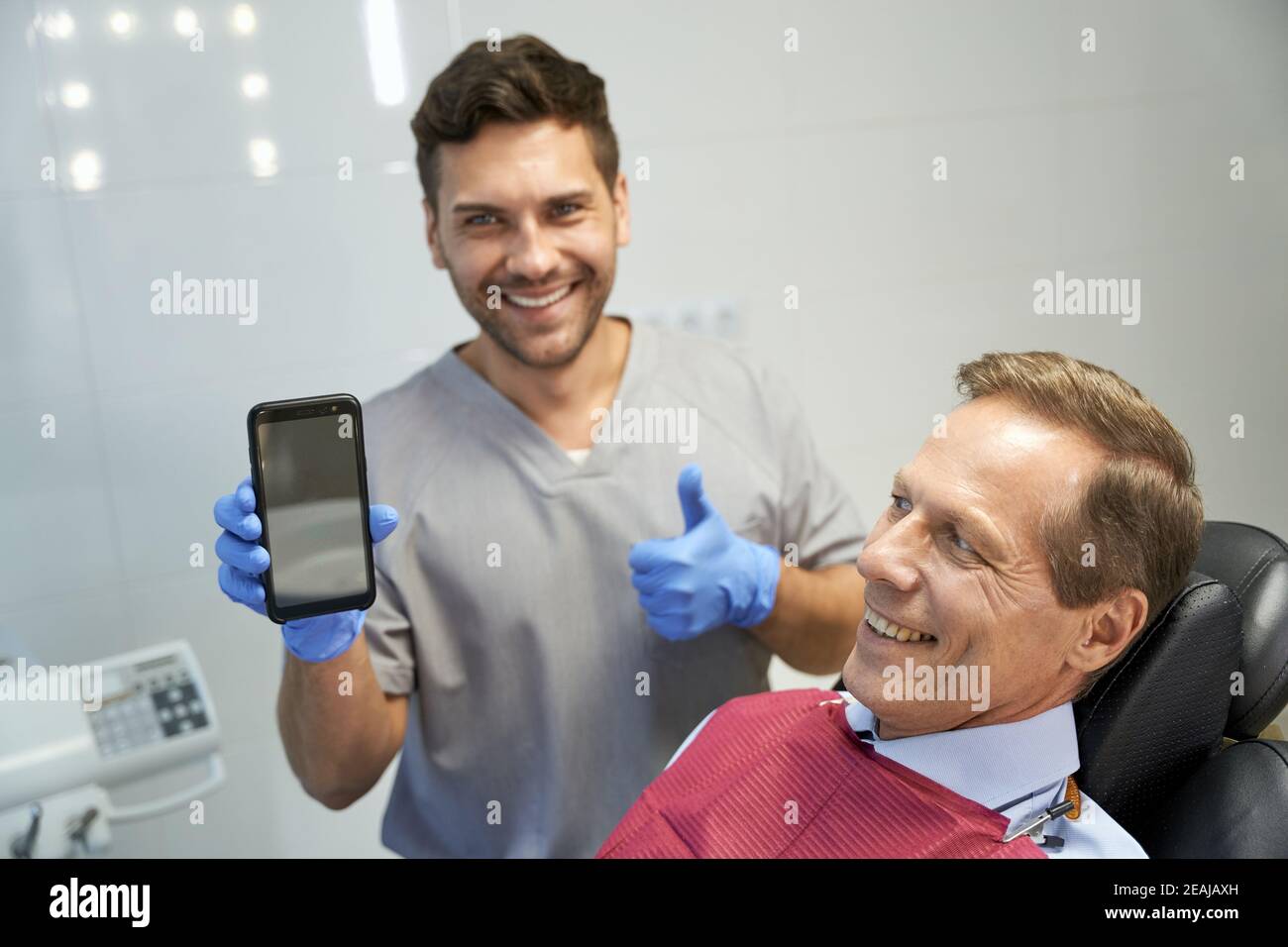 Booking dental appointments online now available at clinic Stock Photo