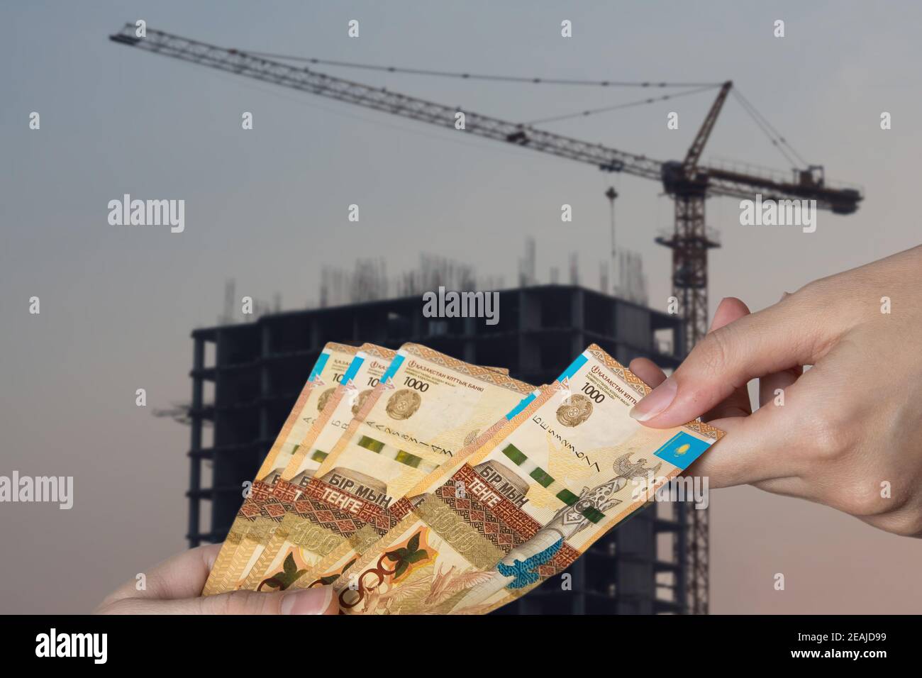 Rising prices for housing and apartments in Kazakhstan. Kazakhstan tenge against the background of new buildings. Real estate services Stock Photo