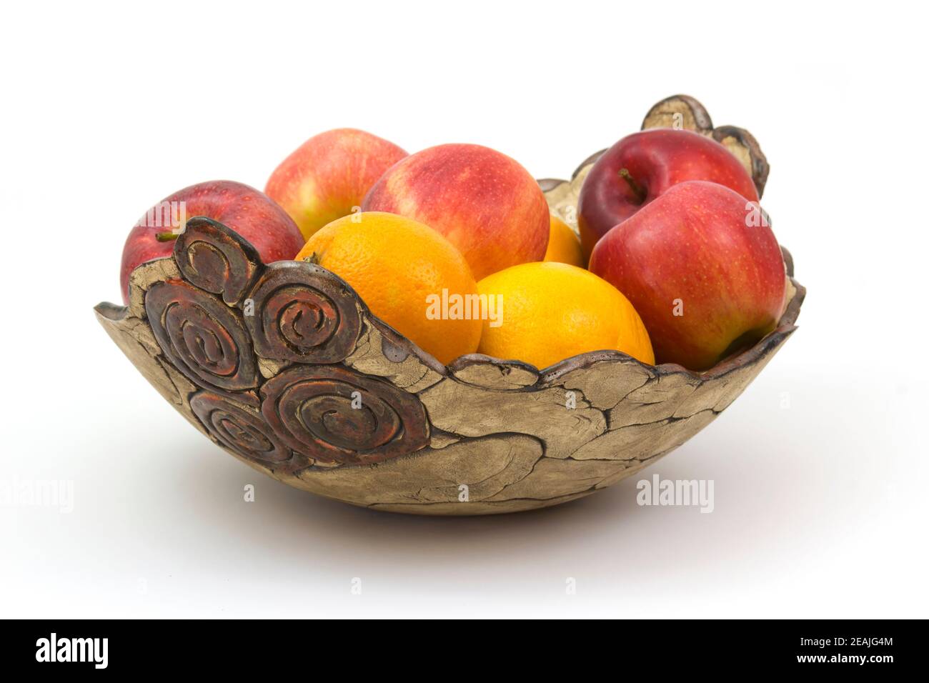 fresh fruits in a clay bowl Stock Photo