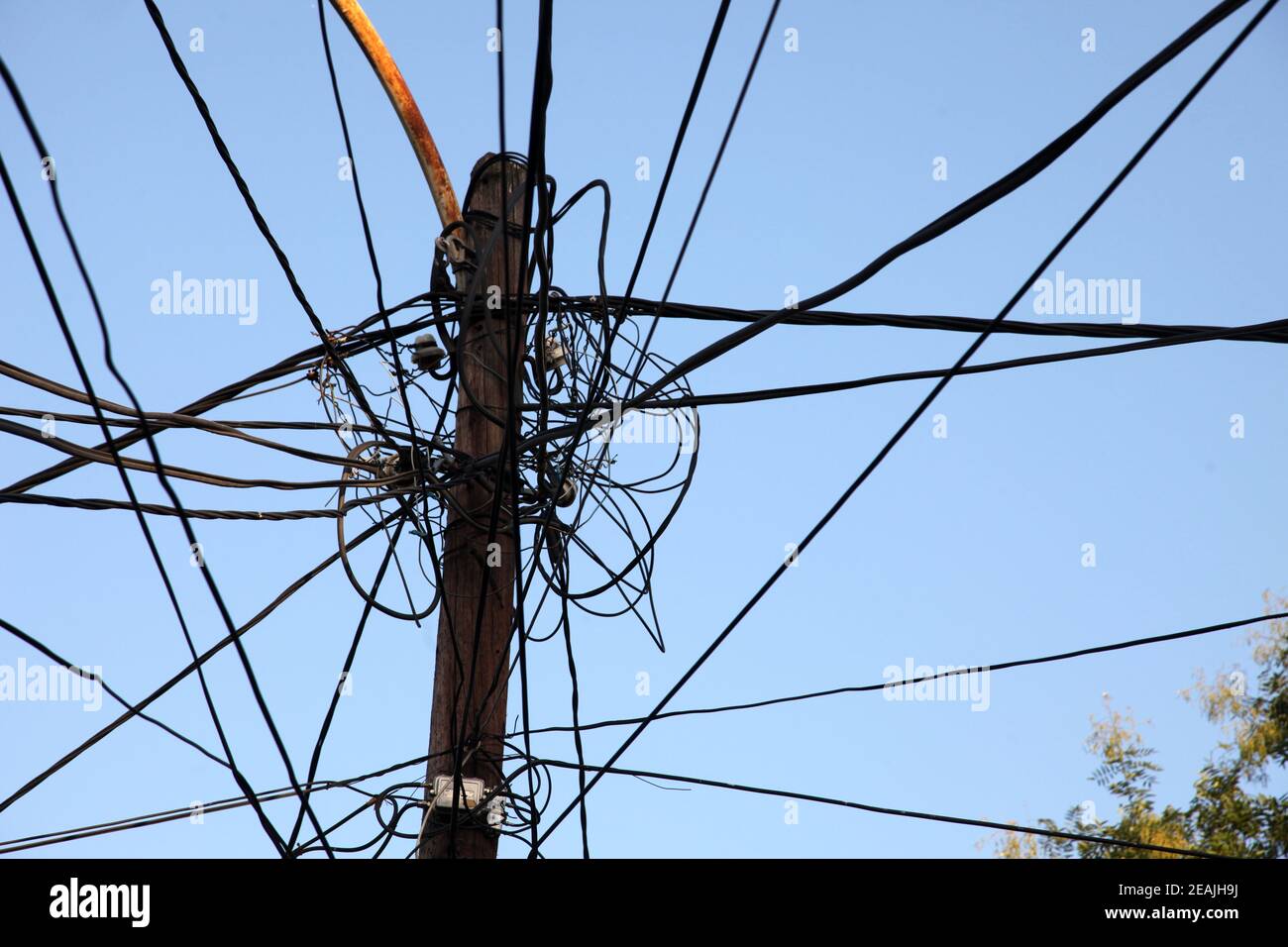 A tangle of electricity and communications cables, television aerials