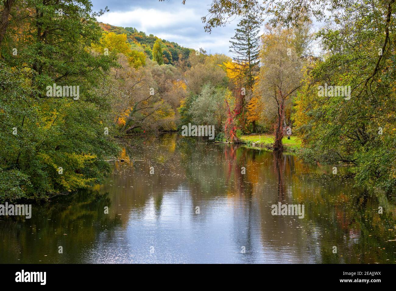 River Glan surrounded with multi colored trees Stock Photo