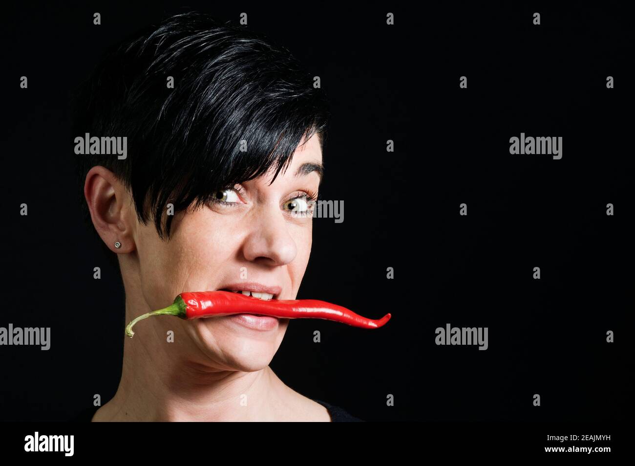 Chilli and black hairs Stock Photo