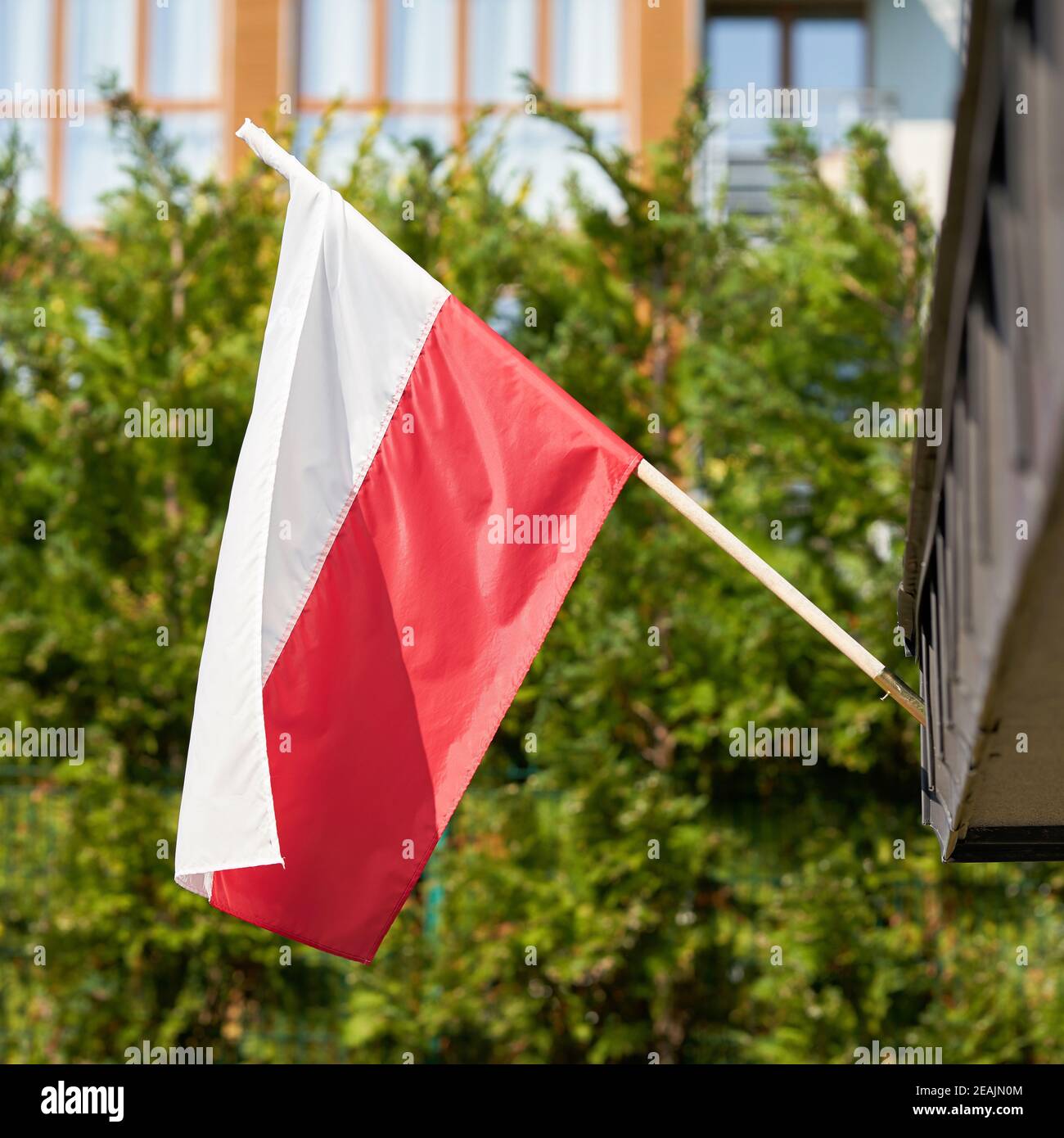 Polish national flag on a house in Swinoujscie in Poland Stock Photo