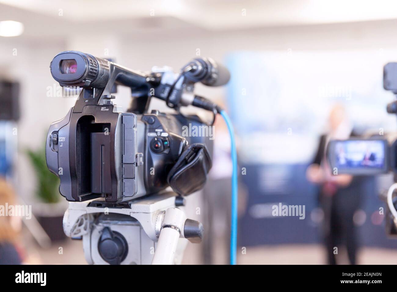 Filming news or press conference with a video camera Stock Photo