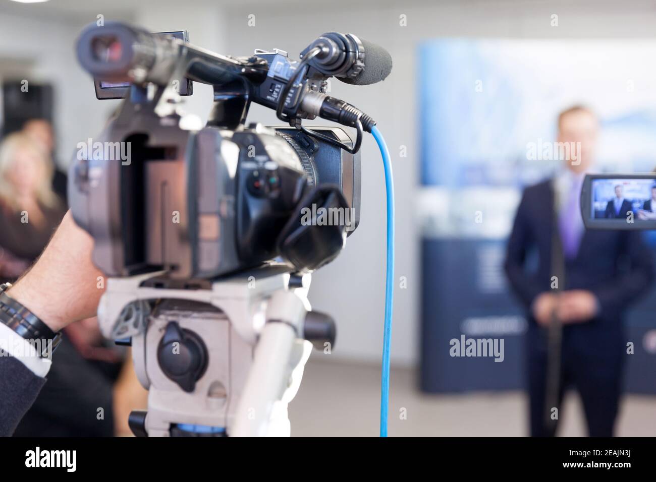 Filming press or news conference with a video camera Stock Photo