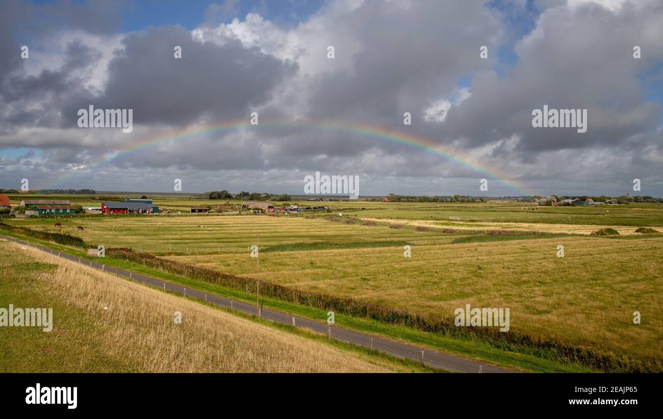 Rainbow over Westerhever Stock Photo