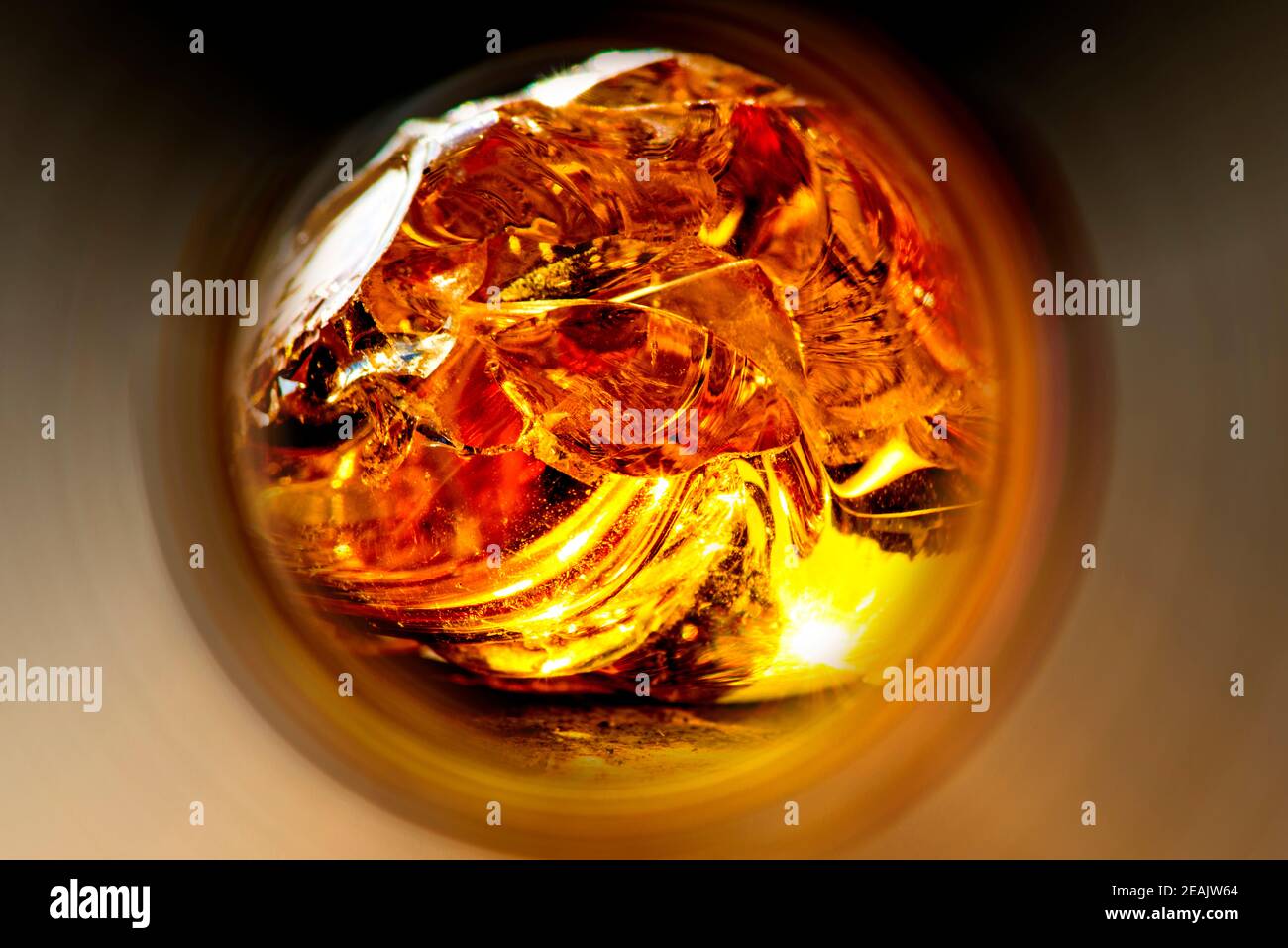 Amber shining bright through a round tunnel Stock Photo
