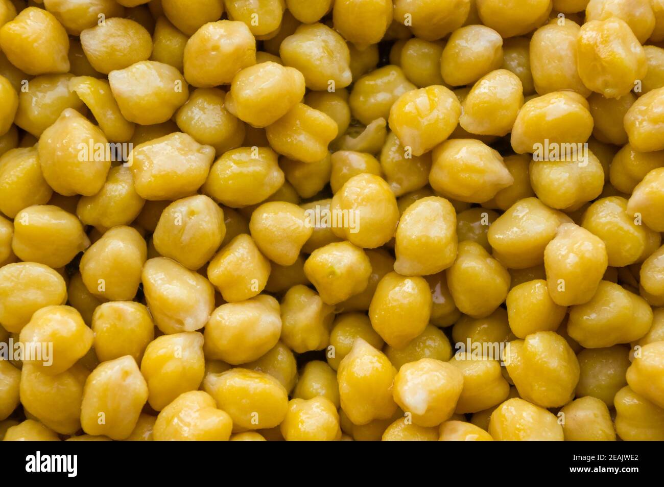 Cooking chickpeas with spices in a pan, close up Stock Photo
