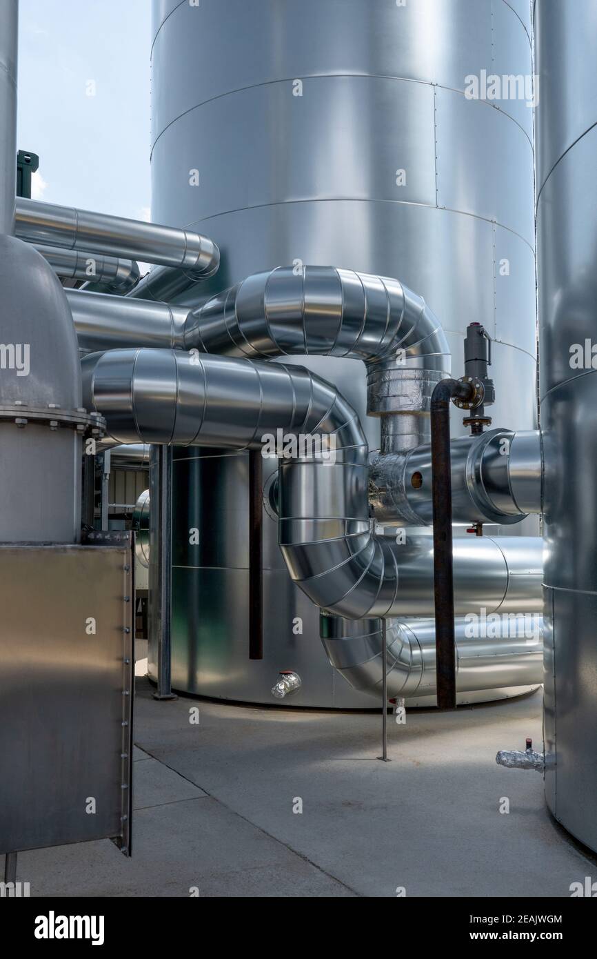 Part of a new industrial plant with pipes and silos Stock Photo
