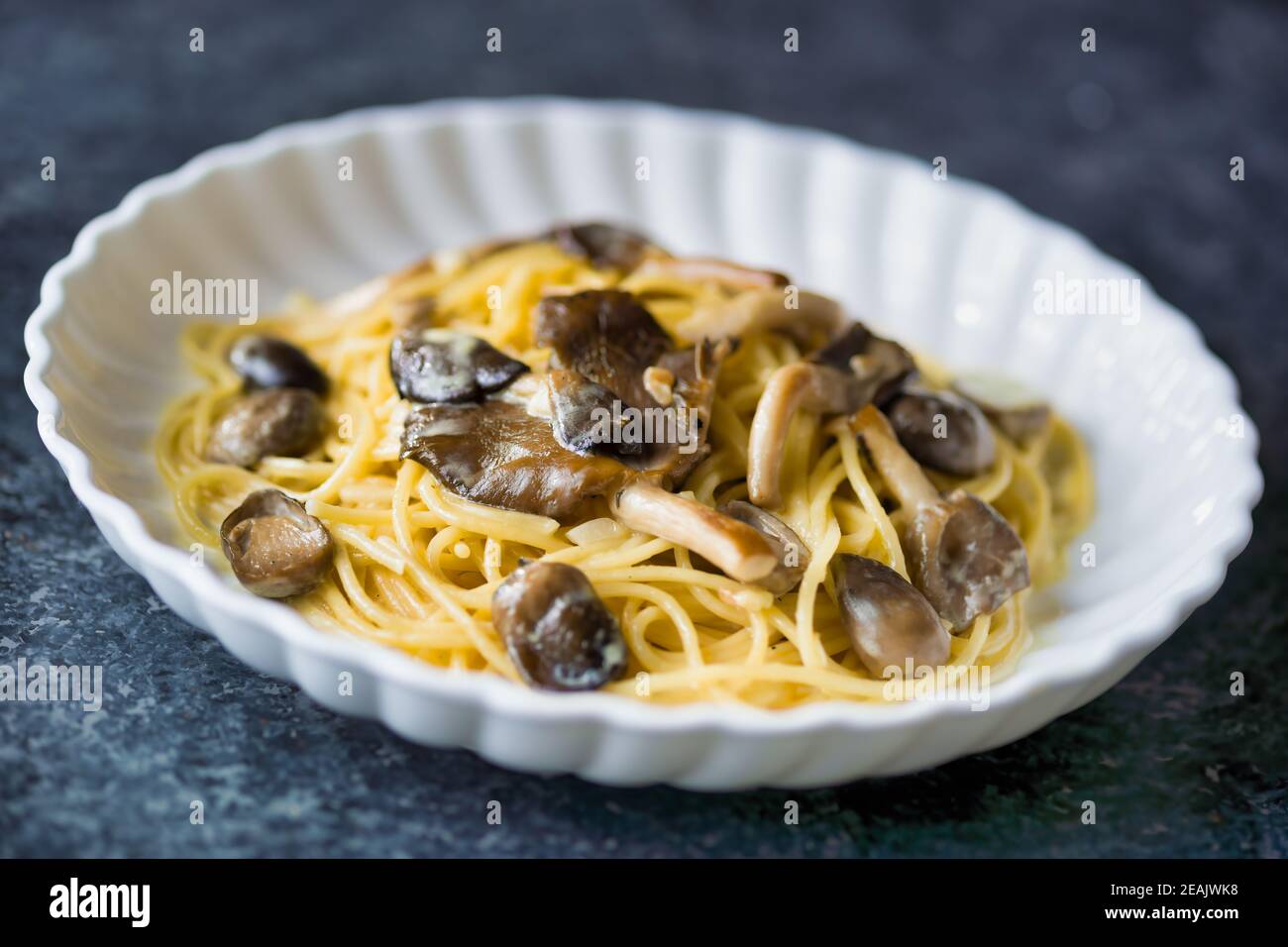 rustic italian spaghetti pasta in mushroom cream sauce Stock Photo Alamy