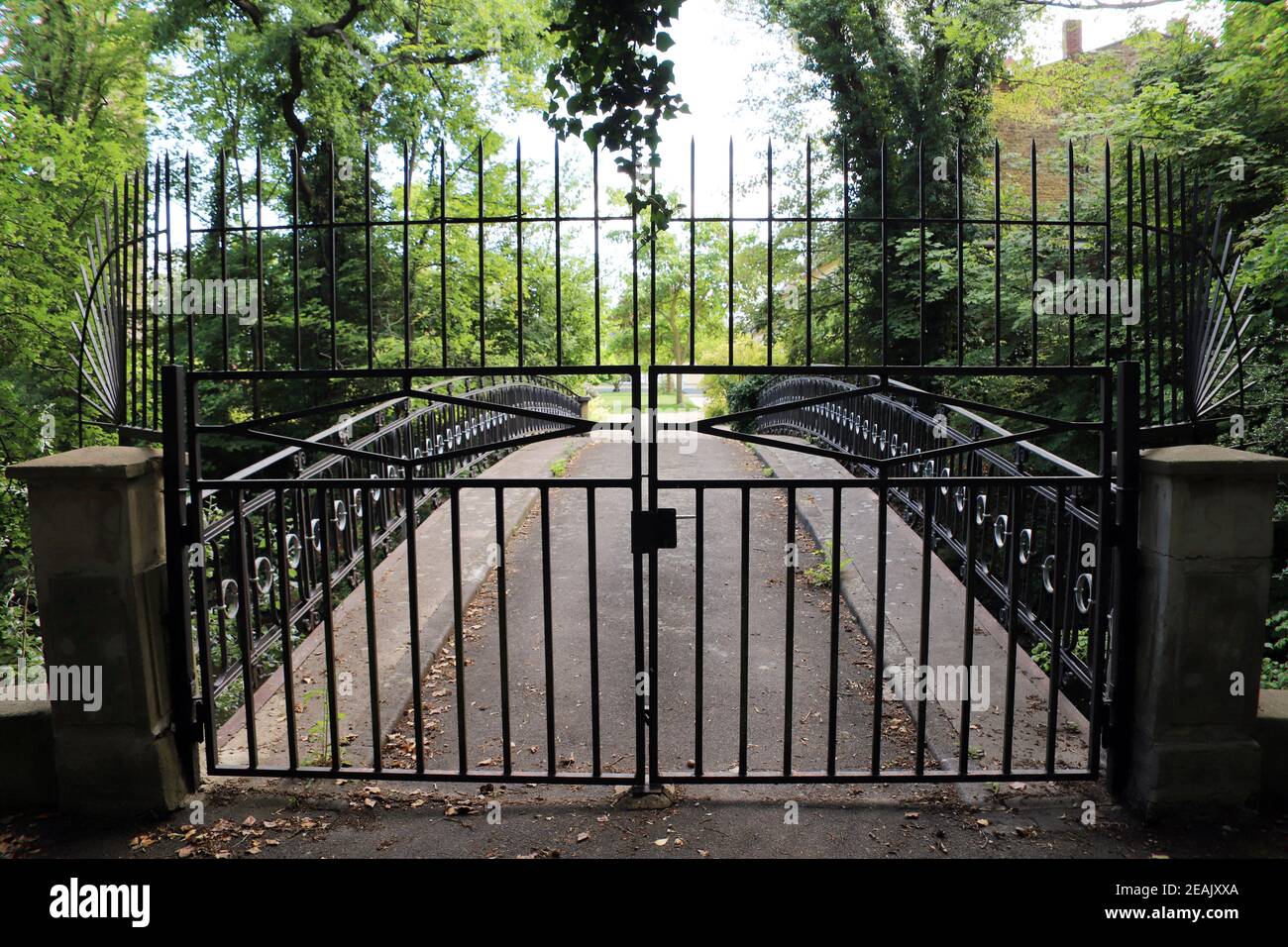 Closed gate from the park to the state castle Lechenich, water castle from the 14th century Stock Photo