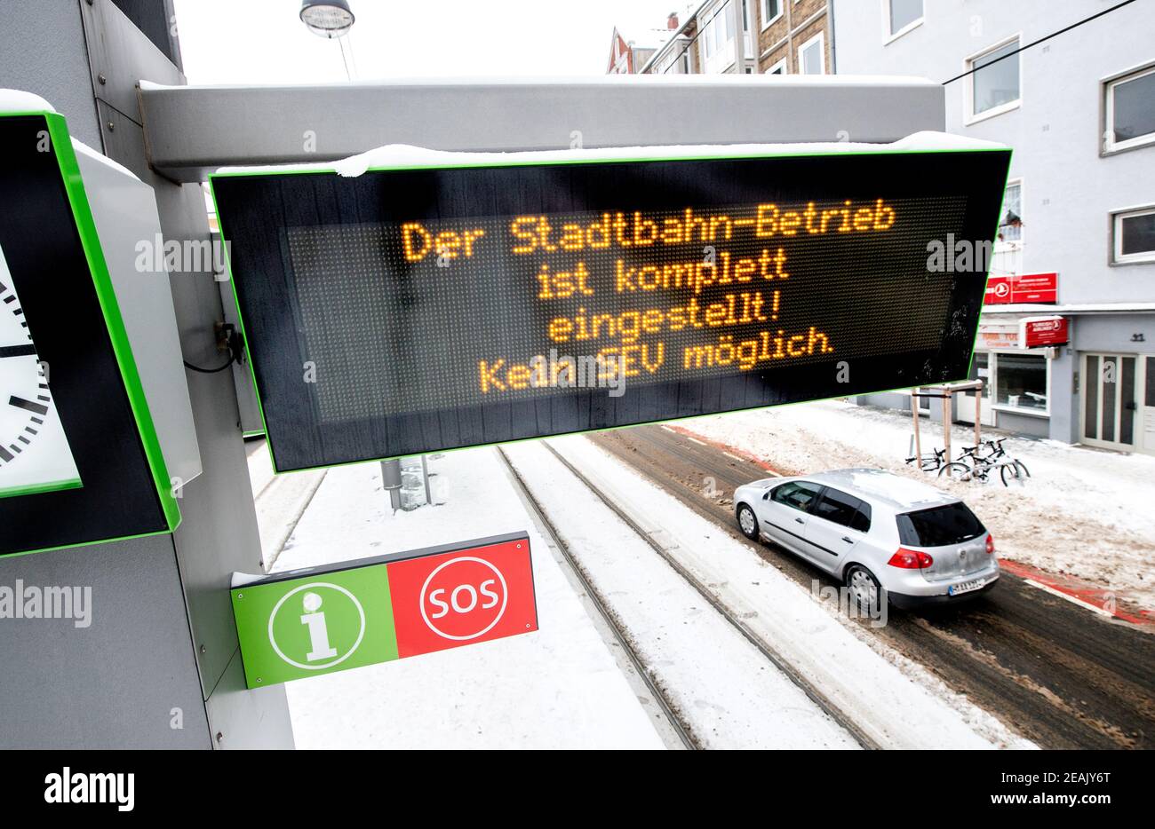 Hanover, Germany. 10th Feb, 2021. A display reading 'Light rail service is completely suspended! No SEV possible.' hangs at the stop of the light rail at Goetheplatz in Calenberger Neustadt. Due to frost and snow, the ÜSTRA Hannoversche Verkehrsbetriebe have suspended rail services throughout the city. Credit: Hauke-Christian Dittrich/dpa/Alamy Live News Stock Photo