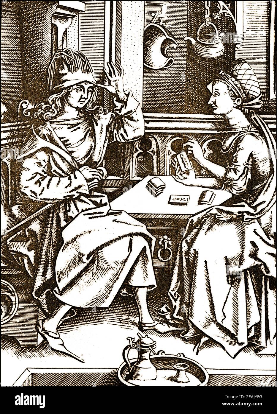 A scene showing a medieval man having his fortune told by a tarot reader. Stock Photo