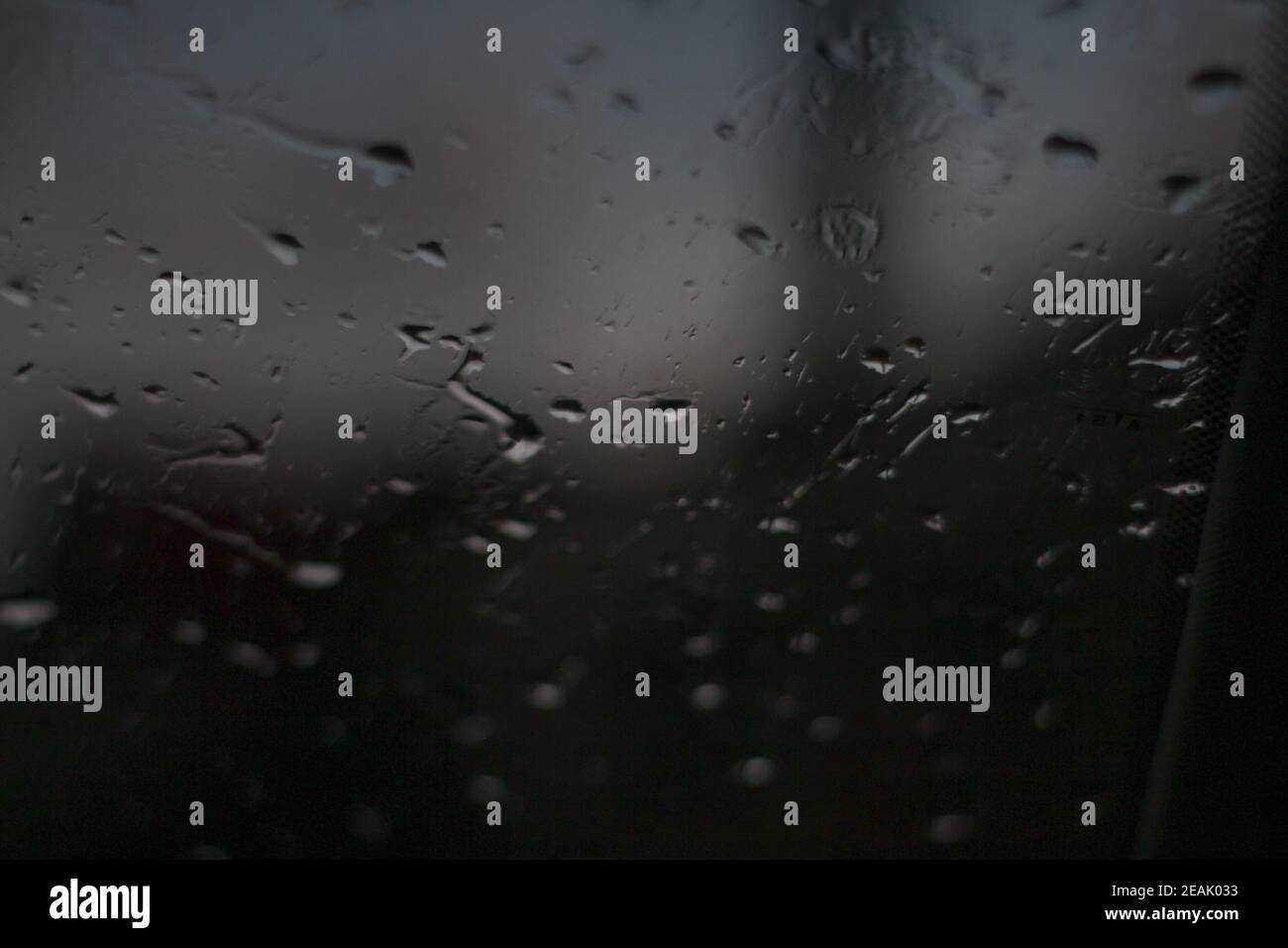 Rain drops on the window in the dark - water on the window Stock Photo