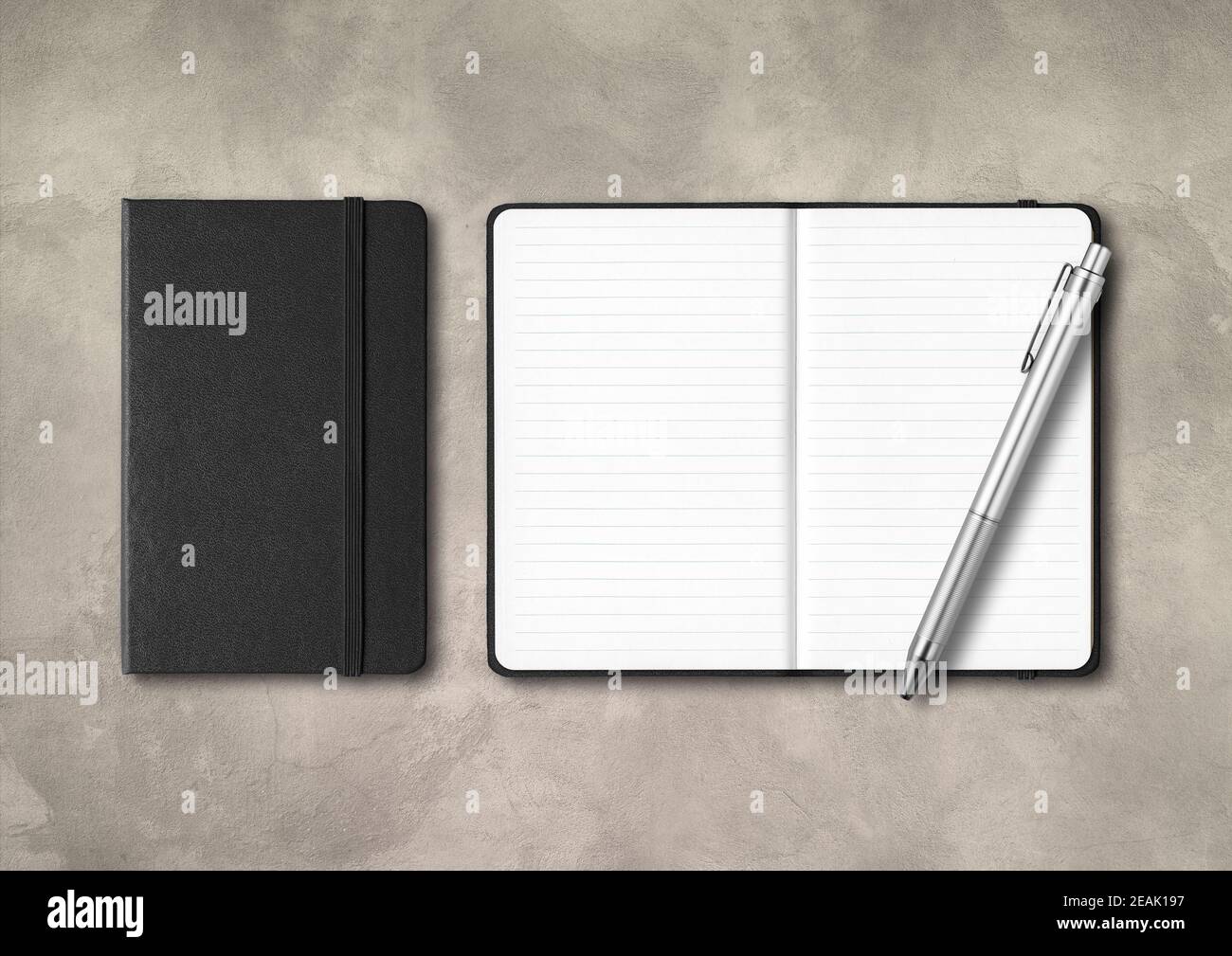 Black closed and open lined notebooks with a pen on concrete background Stock Photo
