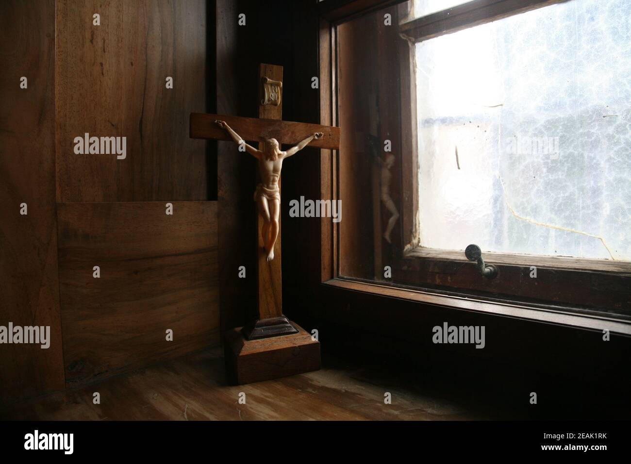Cross at the window Stock Photo - Alamy