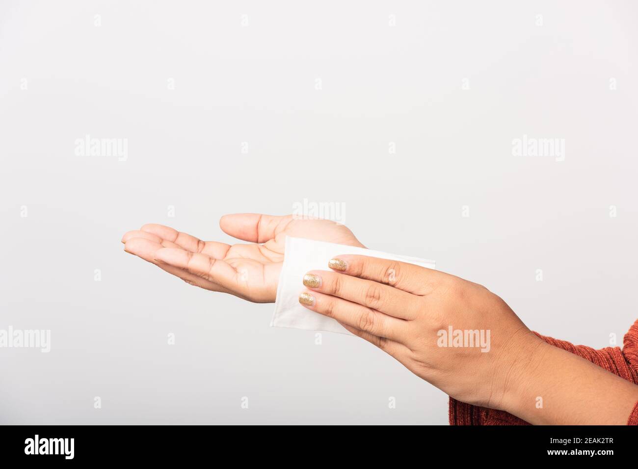 woman she using wet tissue paper wipe cleaning her hands Stock Photo