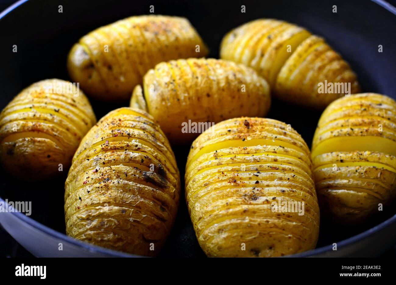 Baked crispy hasselback potatoes Stock Photo Alamy