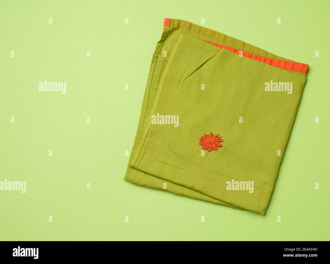 folded green napkin, green background Stock Photo Alamy