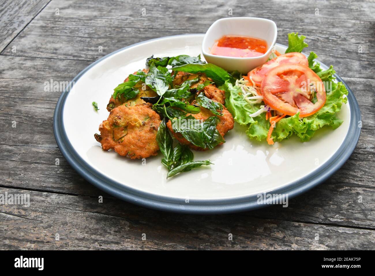 Thai deep fried shrimp cakes with salad Stock Photo
