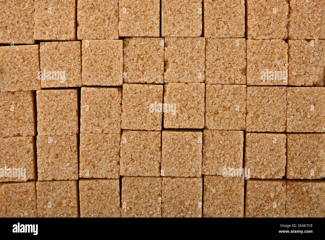 Background texture pattern of brown sugar cubes Stock Photo