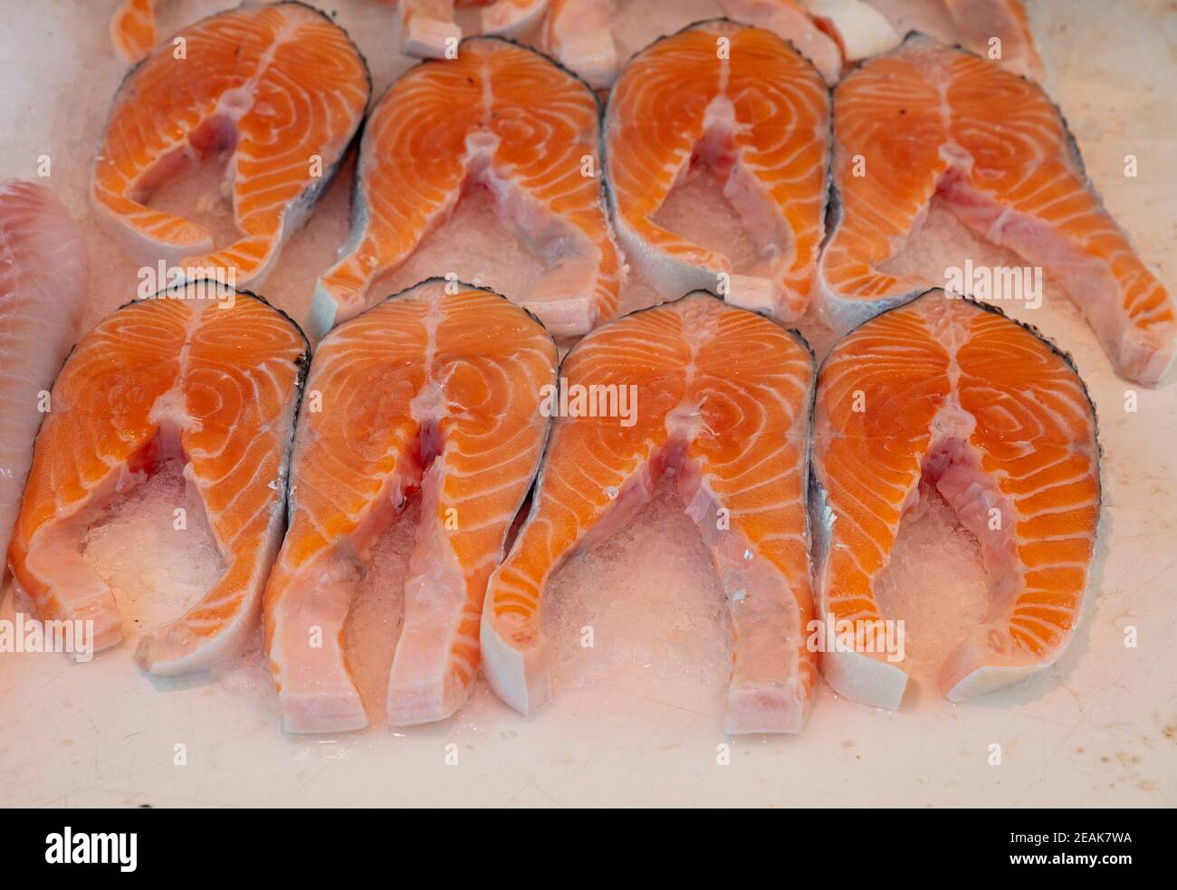 Raw salmon fish steaks on ice Stock Photo - Alamy