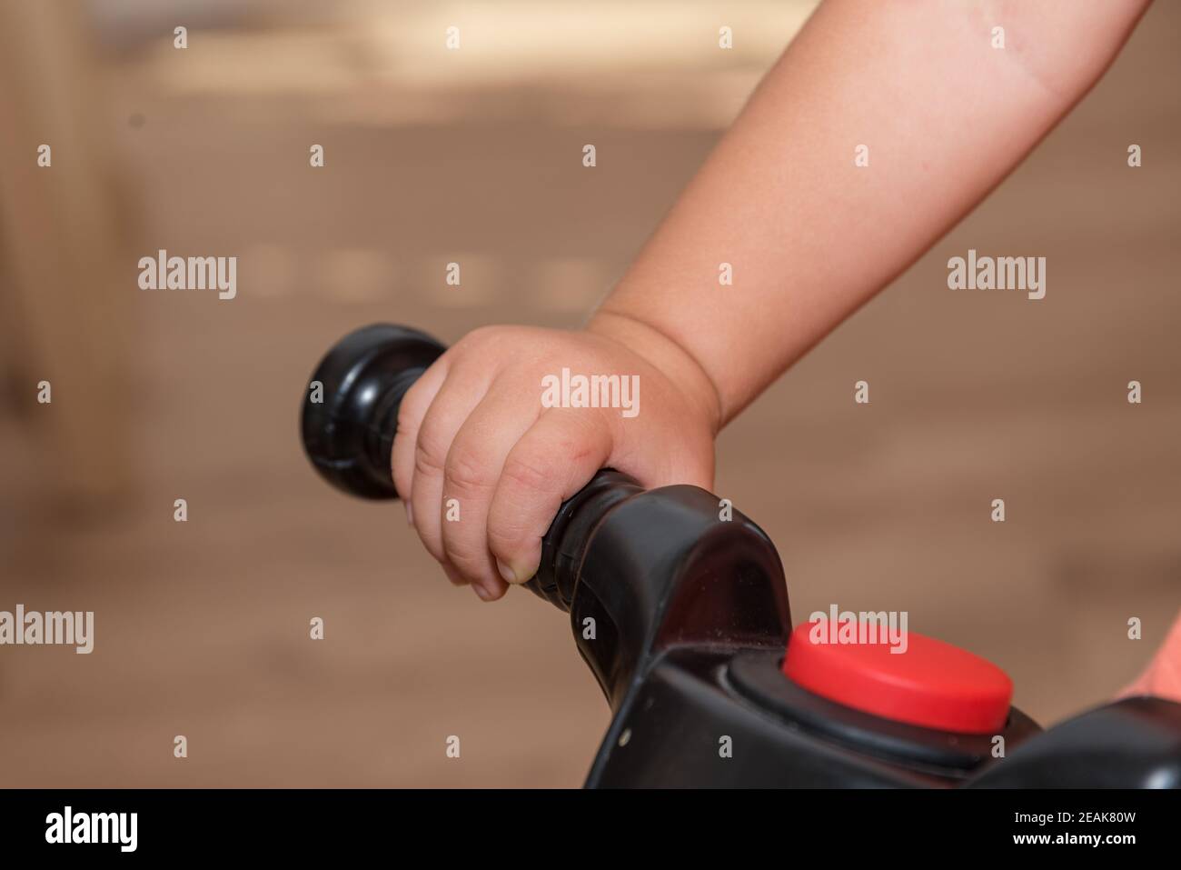 Child's hand holds on - close-up Stock Photo