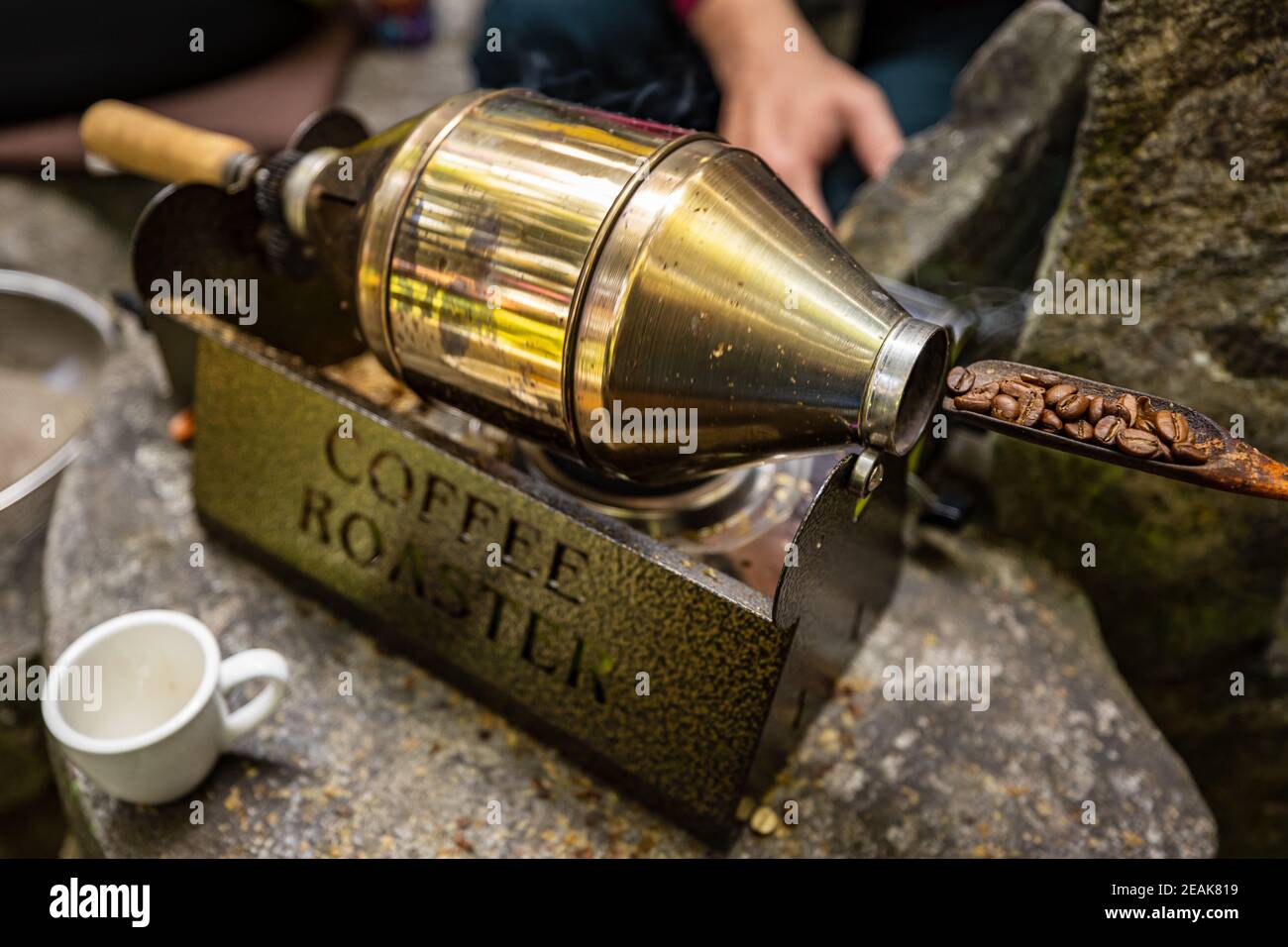 Coffee roasting with a small roaster at home Stock Photo