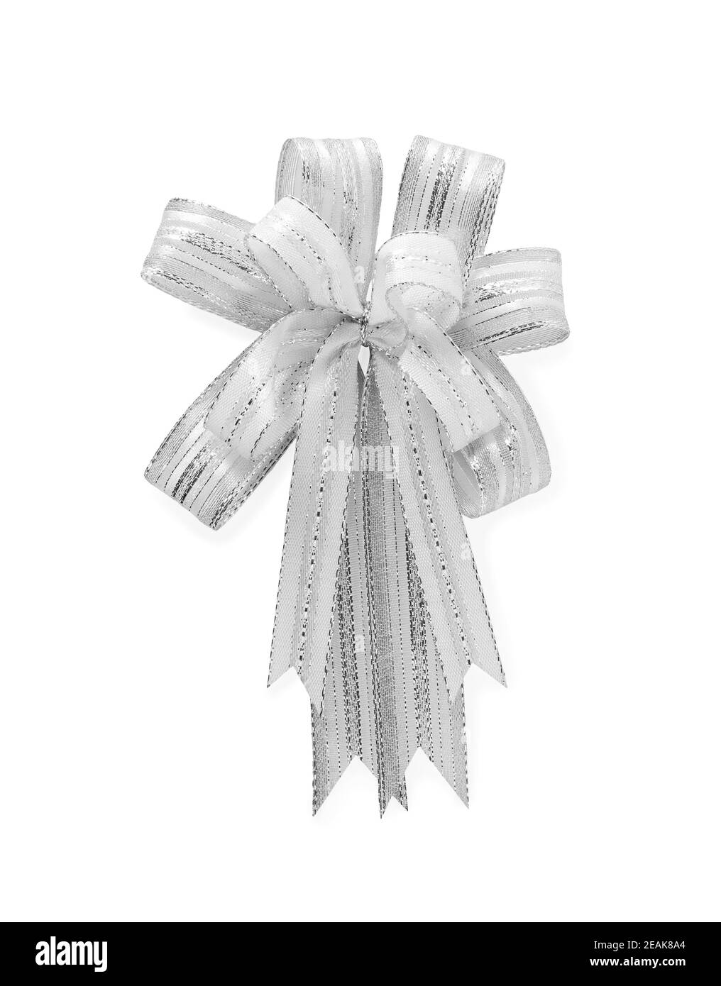 Shiny silver tied festive bow ribbon on white background. Stock Photo
