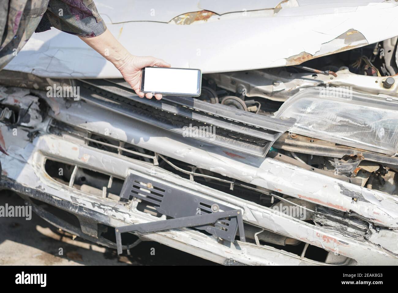 hand take photo of crashed damaged broken car. automobile crash