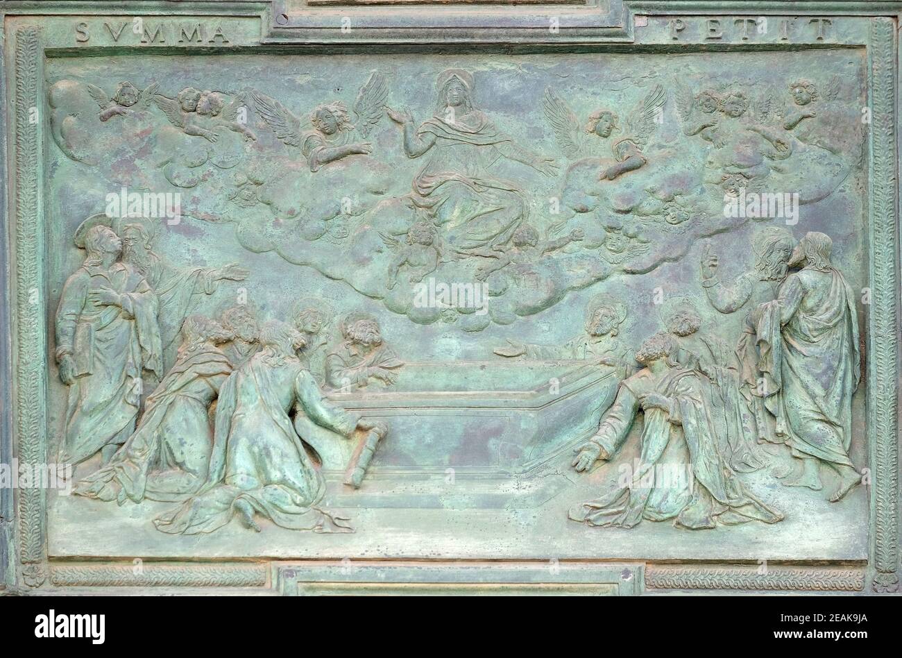Assumption of the Virgin Mary, panel from Giambologna's school, collocated in the central portal of the Cathedral St. Mary of the Assumption in Pisa, Italy Stock Photo
