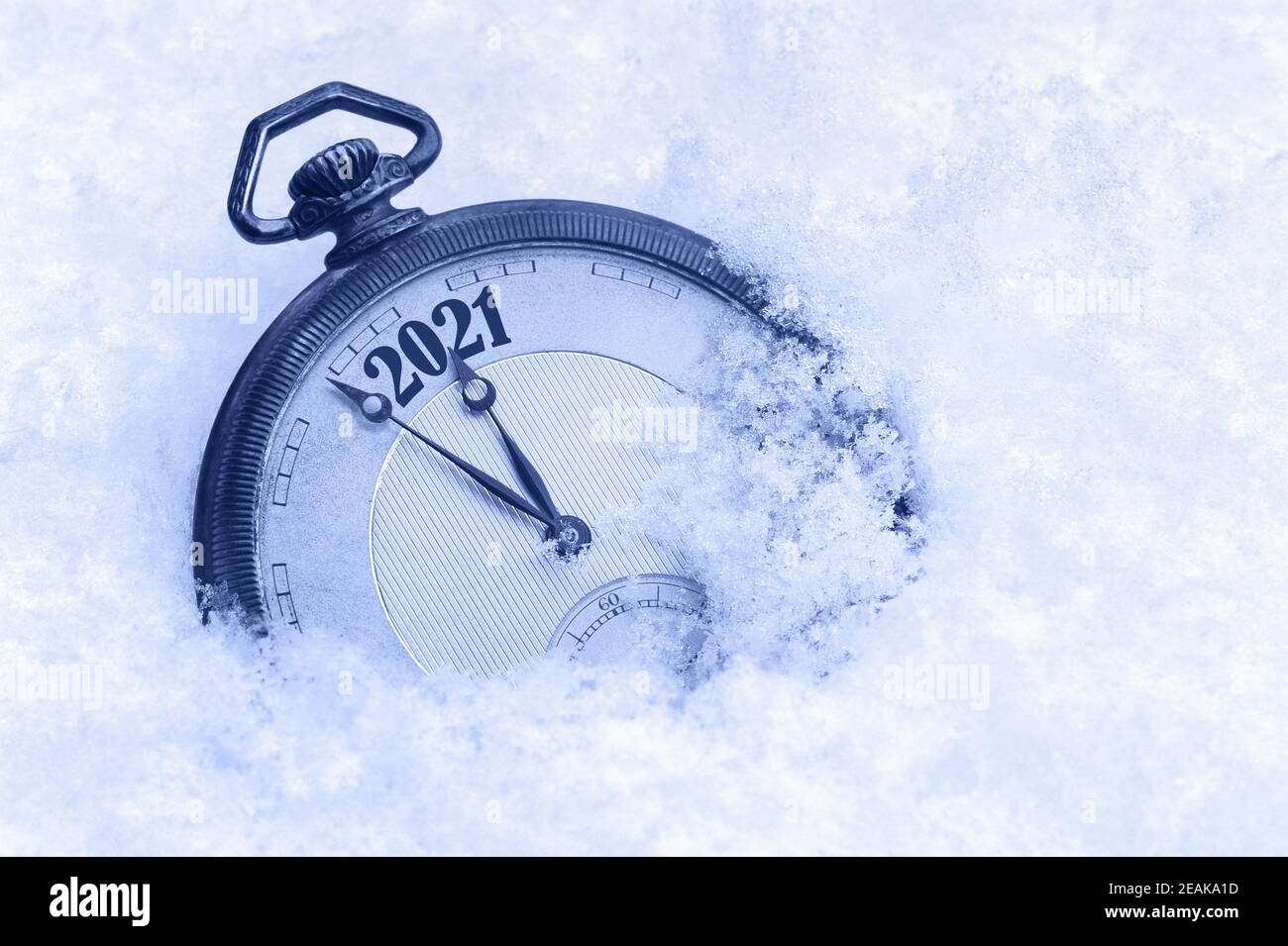 New Year 2021 greeting card, 2021 new year, pocket watch in snow, happy new year concept, countdown to midnight Stock Photo