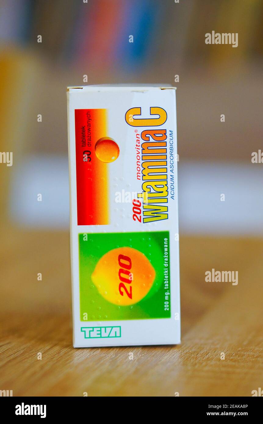POZNAN, POLAND - Mar 02, 2016: Teva Witamina C medicine in a box standing on wooden table Stock Photo