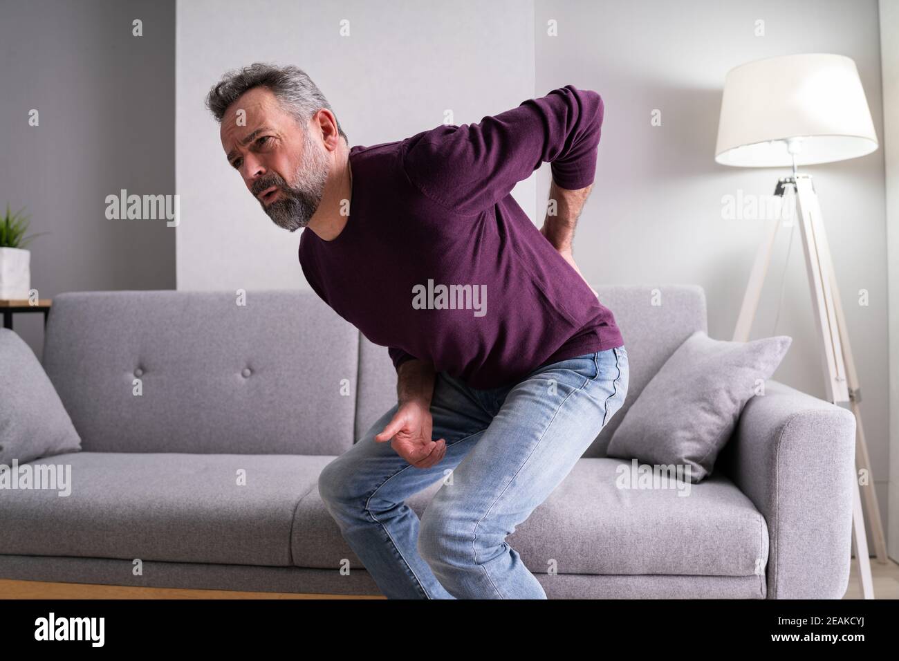 Older Senior Man With Back Pain Stock Photo