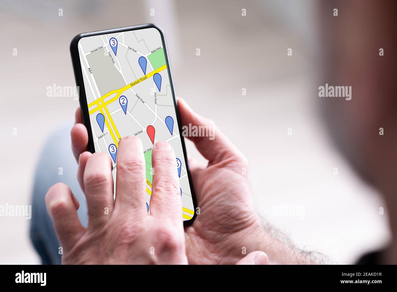 Person's Hand Using GPS Navigation Map Stock Photo
